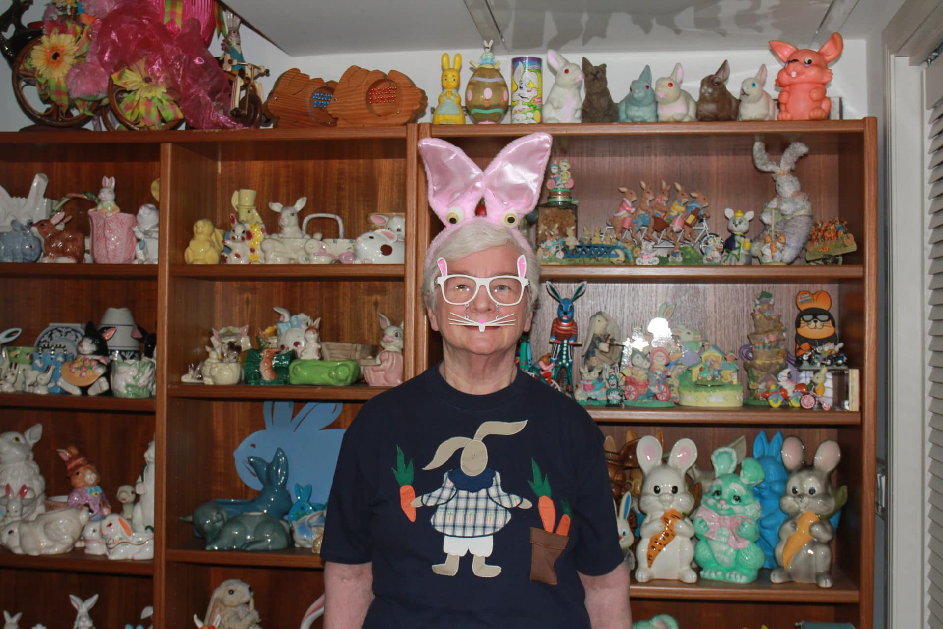 LaVonne Seaworth wears a bunny disguise in the main gallery. She collects rabbit-themed wares and has donated a large portion of her pieces to The Bunny Museum. She travels from Florida each year to visit the museum's growing collection. 