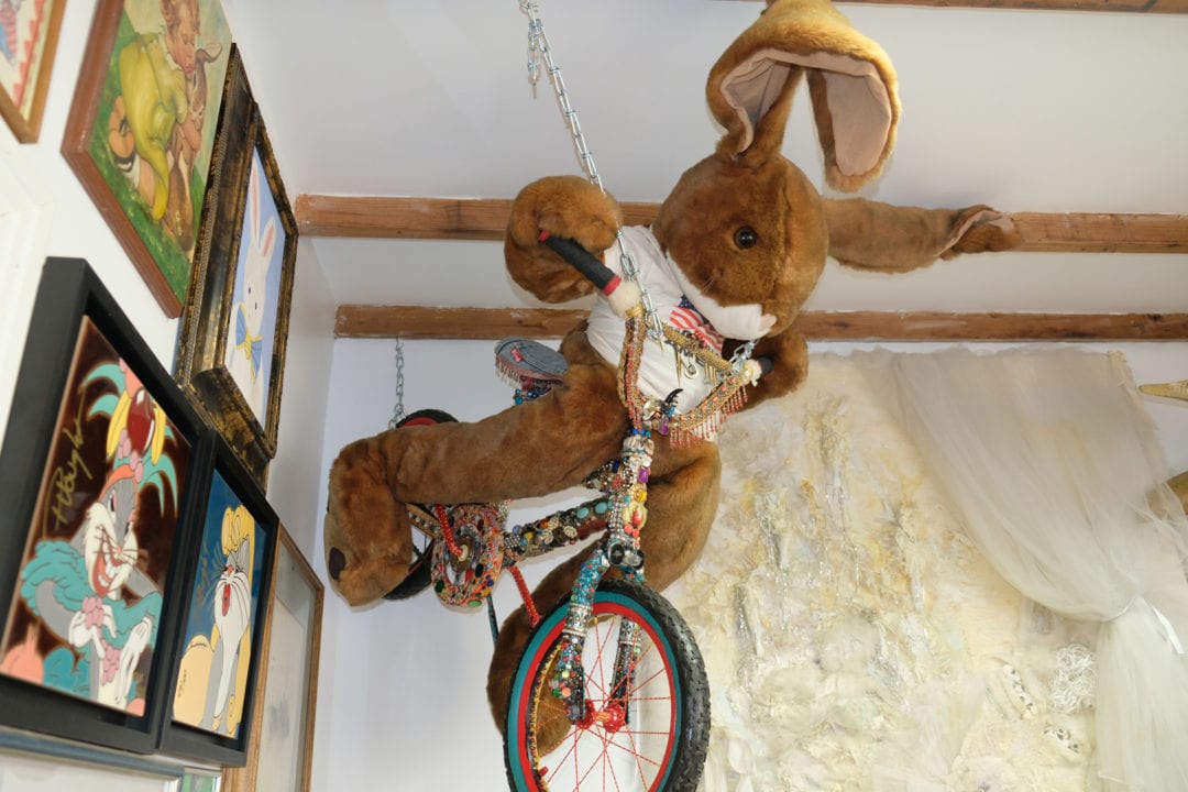 Rabbit riding the “Bling Bike,” an art piece made by local artist Art Romeo. The bicycle is decorated with eight pounds of vintage costume jewelry. 