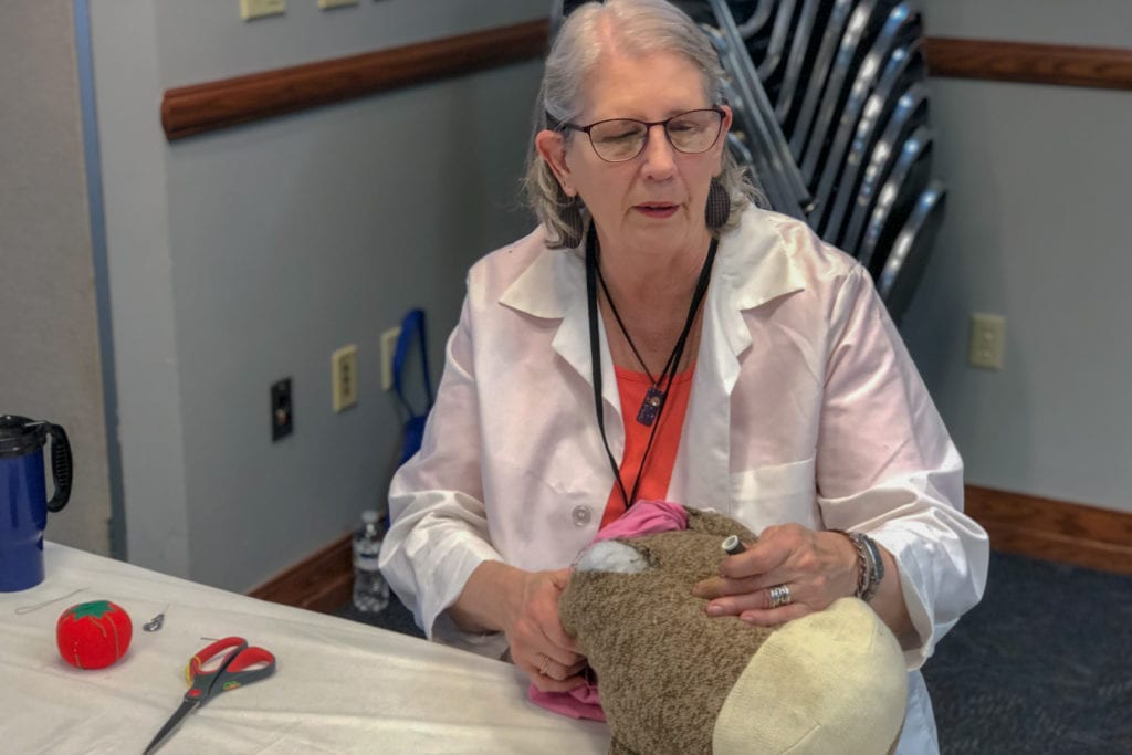 Gretchen Poffinbarger, Midway Village Museum volunteer, was sock monkey doctor for the day