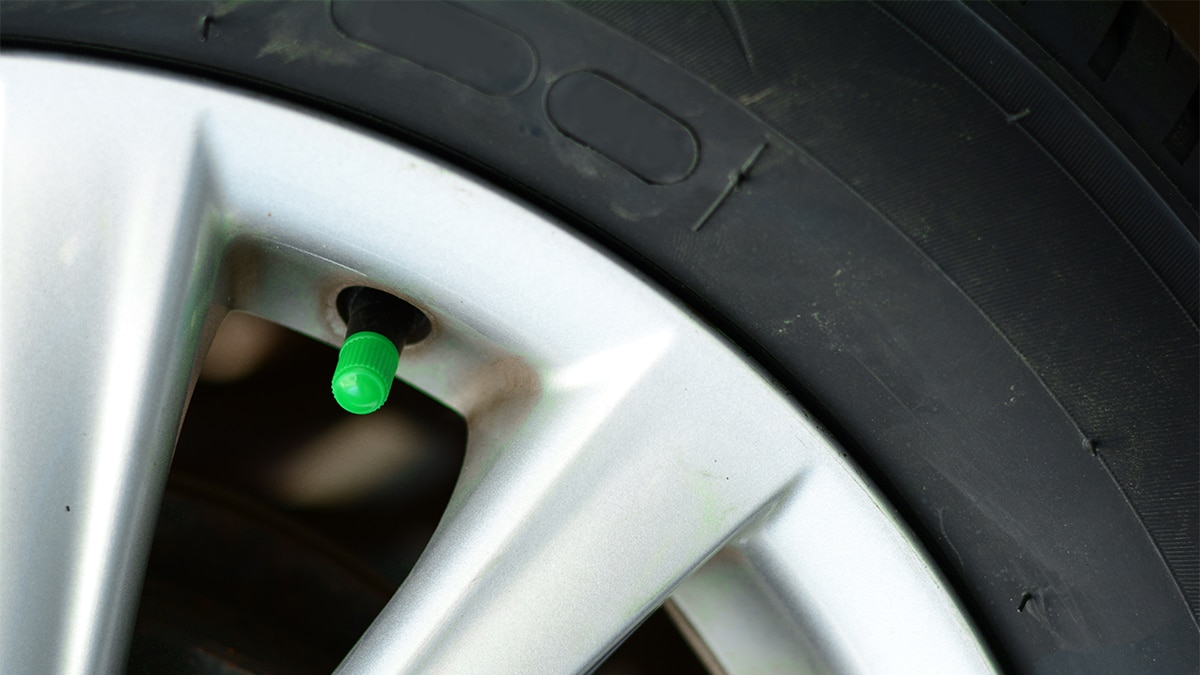 Close-up of RV tire with green cap signaling that it's nitrogen filled