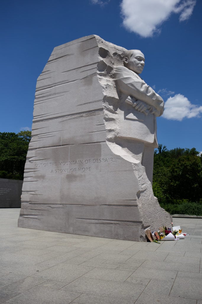 Right: The Martin Luther King Jr. Memorial, located in West Potomac Park next to the National Mall, is a frequent starting or ending point to several different demonstrations. Mementos are left at the foot of the granite statue.