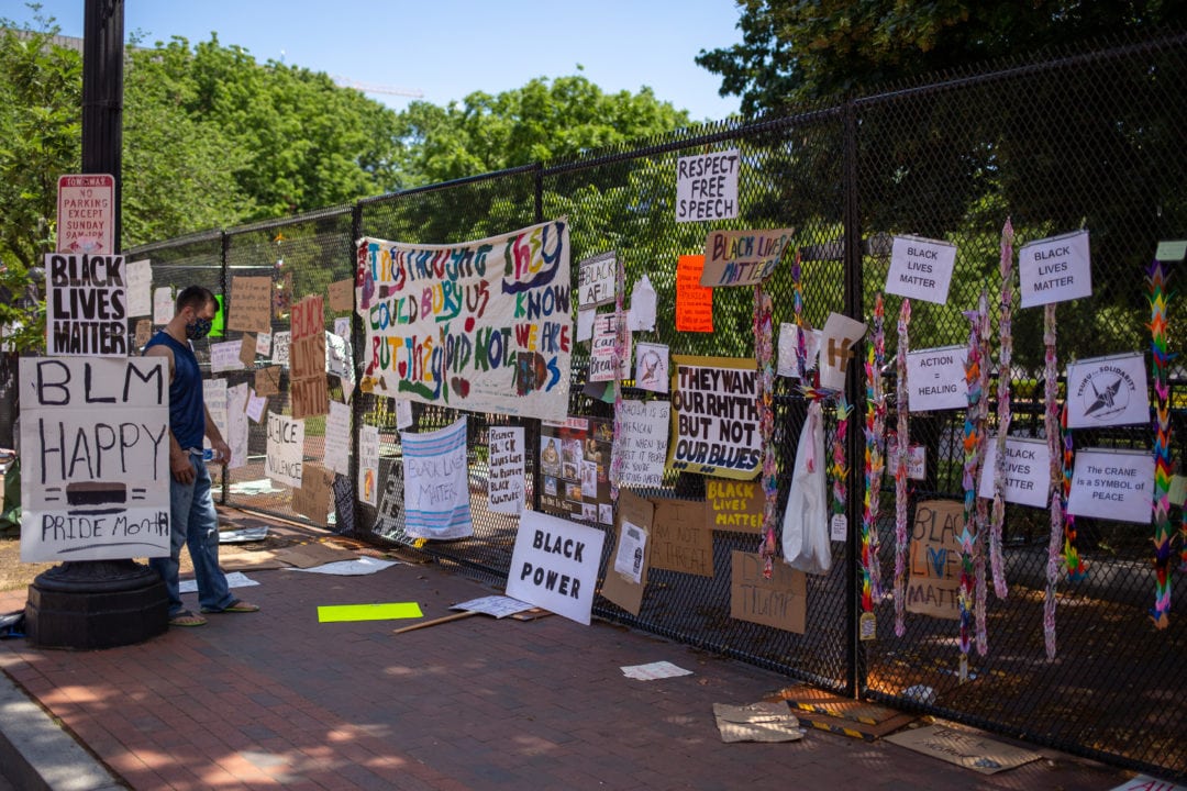 The fence around Lafayette Square quickly becomes a defacto art gallery with people contributing signs, artwork, and other memorabilia. 