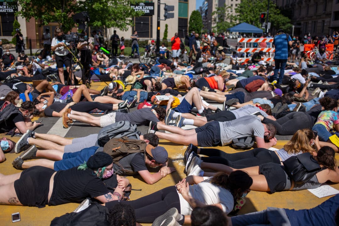 Demonstrators lay on the ground and chant “I can’t breathe” for 8 minutes and 46 seconds, the amount of time Officer Derek Chauvin pressed his knee to Floyd’s neck.