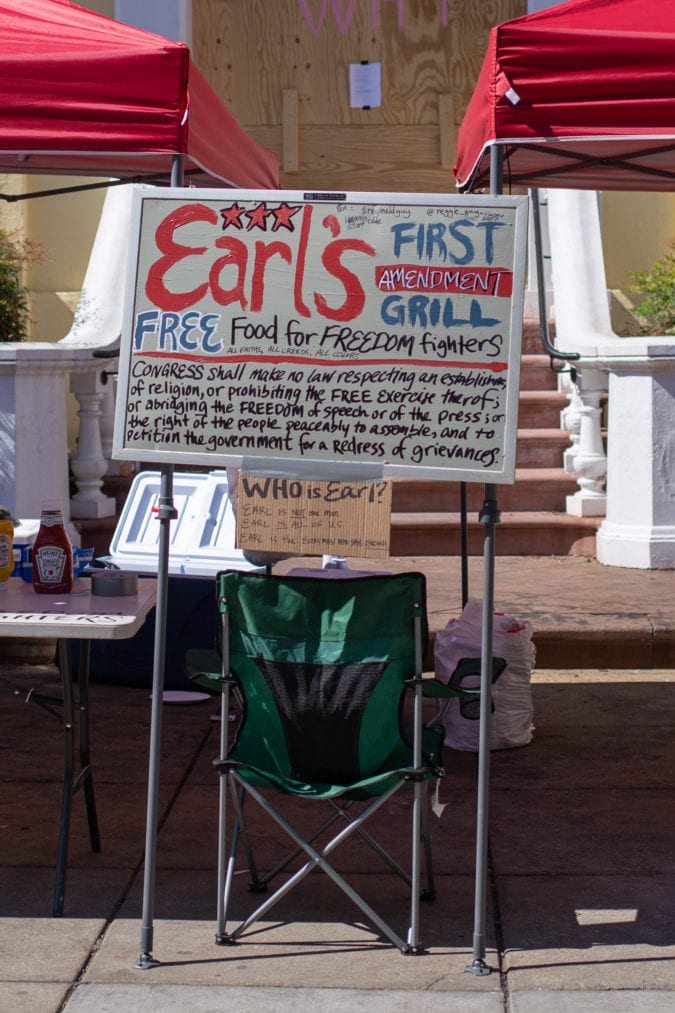 Right: Earl’s First Amendment Grill is just one of several stations that has sprung up around the city to feed and care for the crowds, free of charge.