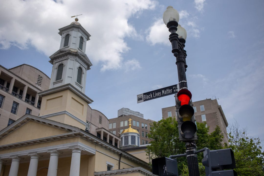 The portion of 16th Street NW just north of the White House was officially designated Black Lives Matter Plaza by Mayor Bowser. Street signs were installed early in the morning on June 5. The steeple of St. John’s Episcopal Church (known as the “Presidents’ Church”) rises in the background.