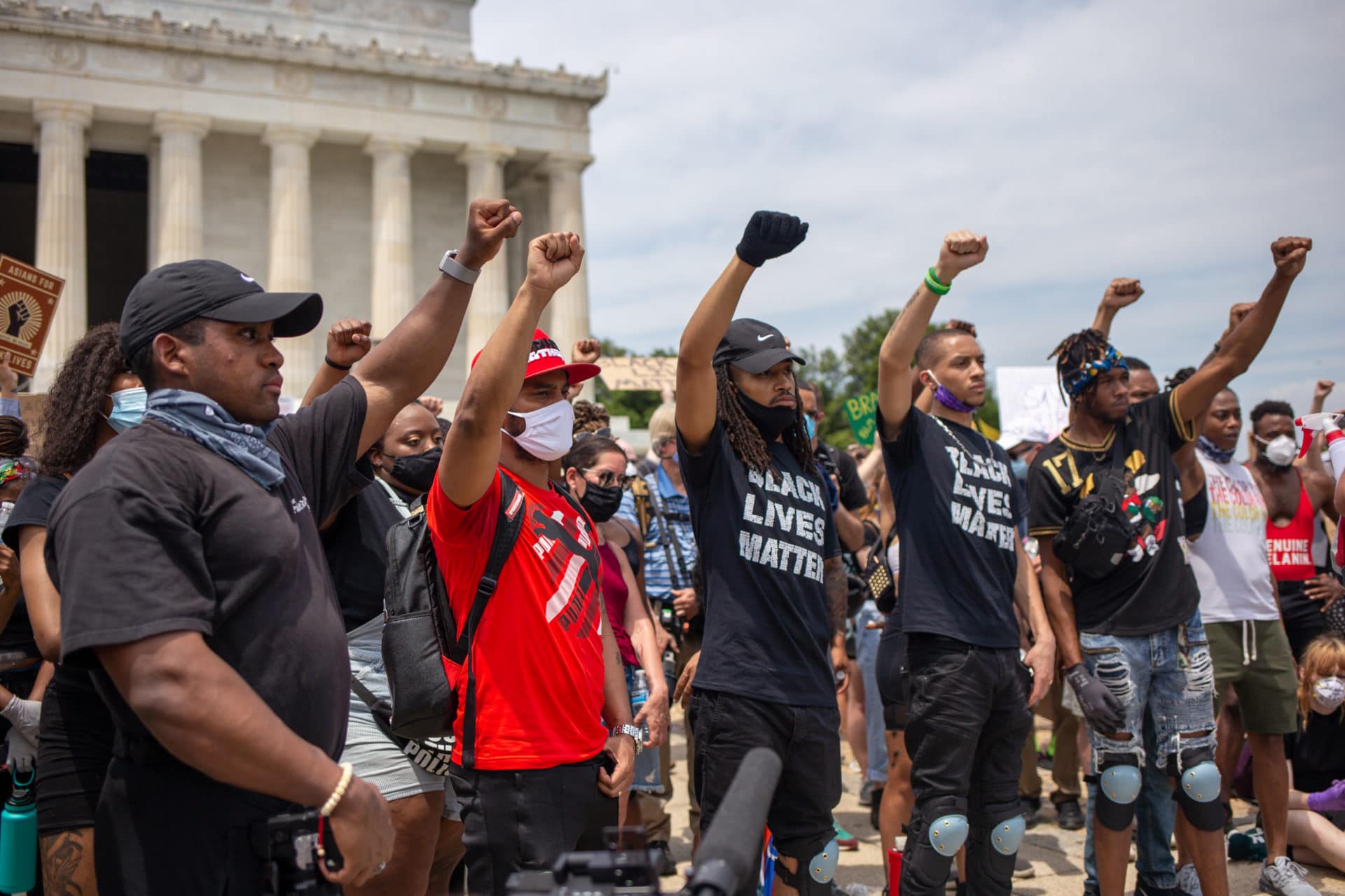Black activists give stirring, emotional speeches to a large crowd gathered on the steps of the Lincoln Memorial.
