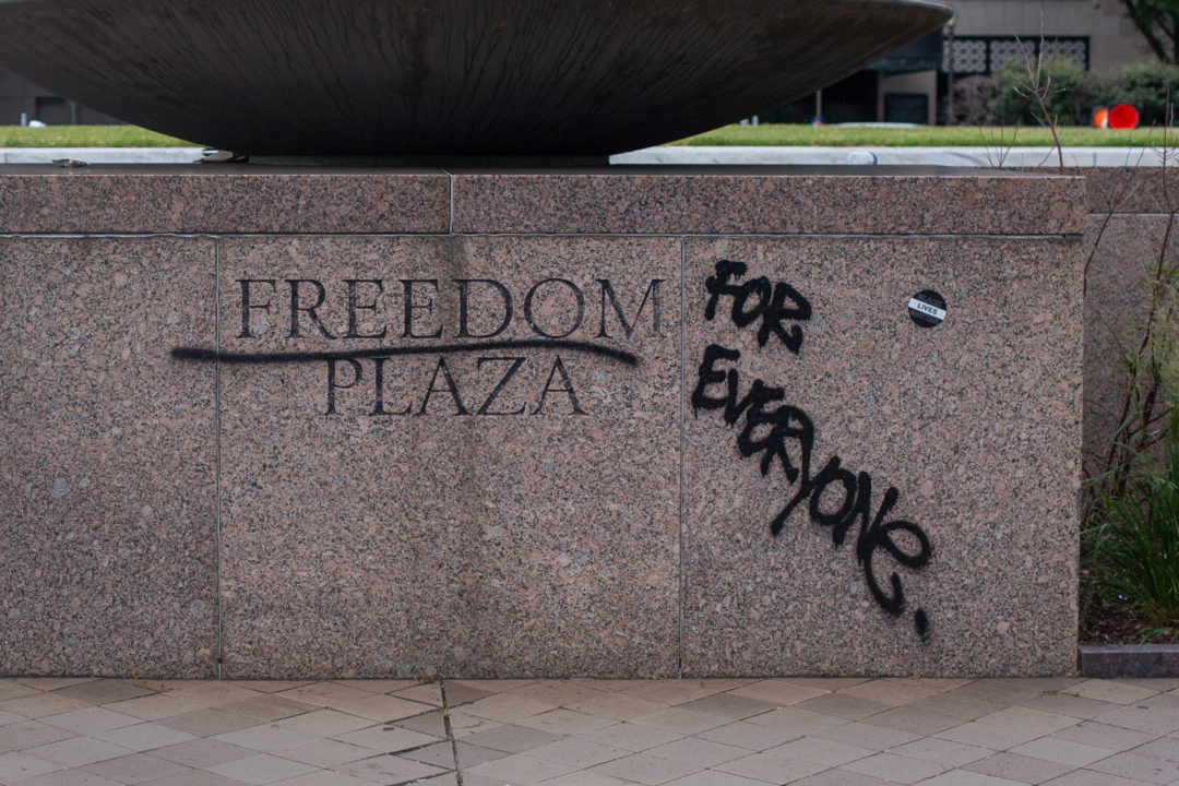Graffiti at Freedom Plaza. The general mood is one of solidarity; on every corner people are passing out free snacks, water, face masks, and hand sanitizer.