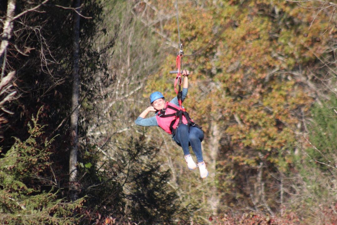 Writer Jess Lander strikes a pose on her zipline tour at Foxfire Mountain.