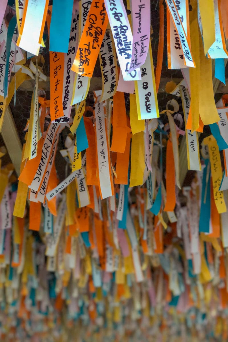 Thousands of colorful wish strips.