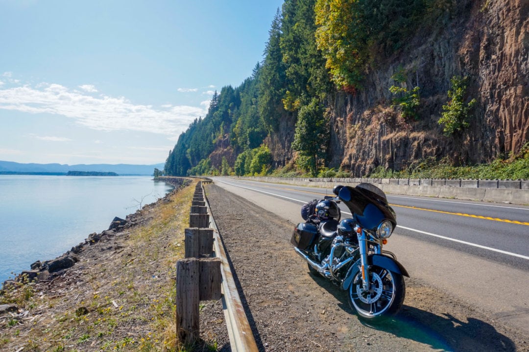 A Harley-Davidson Street Glide parked alongside a scenic road in Washington state