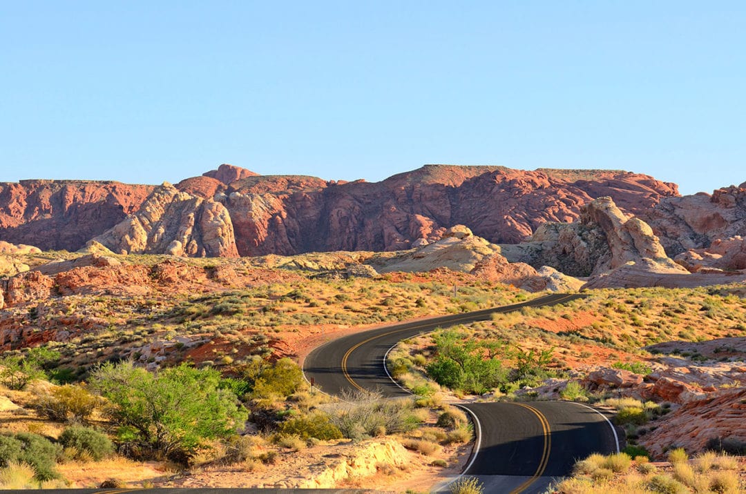 Winding road through colorful desert landscape