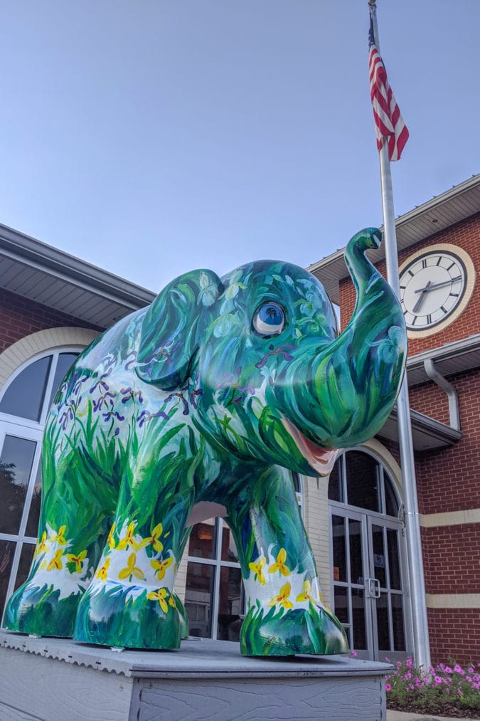 An elephant painted with greenery outside Erwin's municipal buildings.