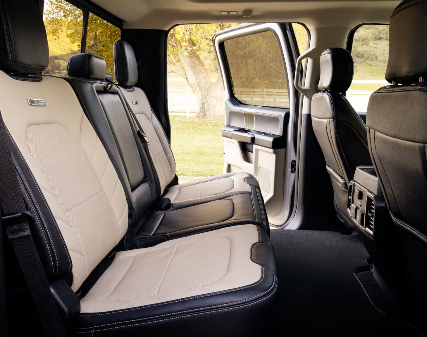 Interior cab of a pickup truck with leather seats and leg room