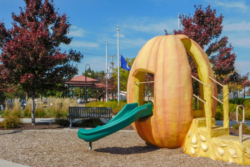 A playground featuring a pumpkin-shaped slide.
