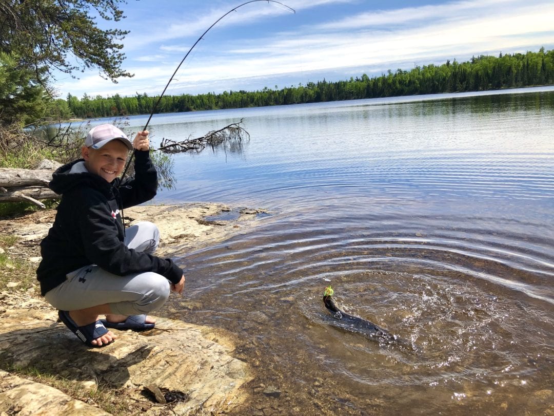 Fishing is part of many great experiences here. After a short portage on day two from Jitterbug to Adventure Lake, Aidan reels in dinner: a 20-inch northern pike. 