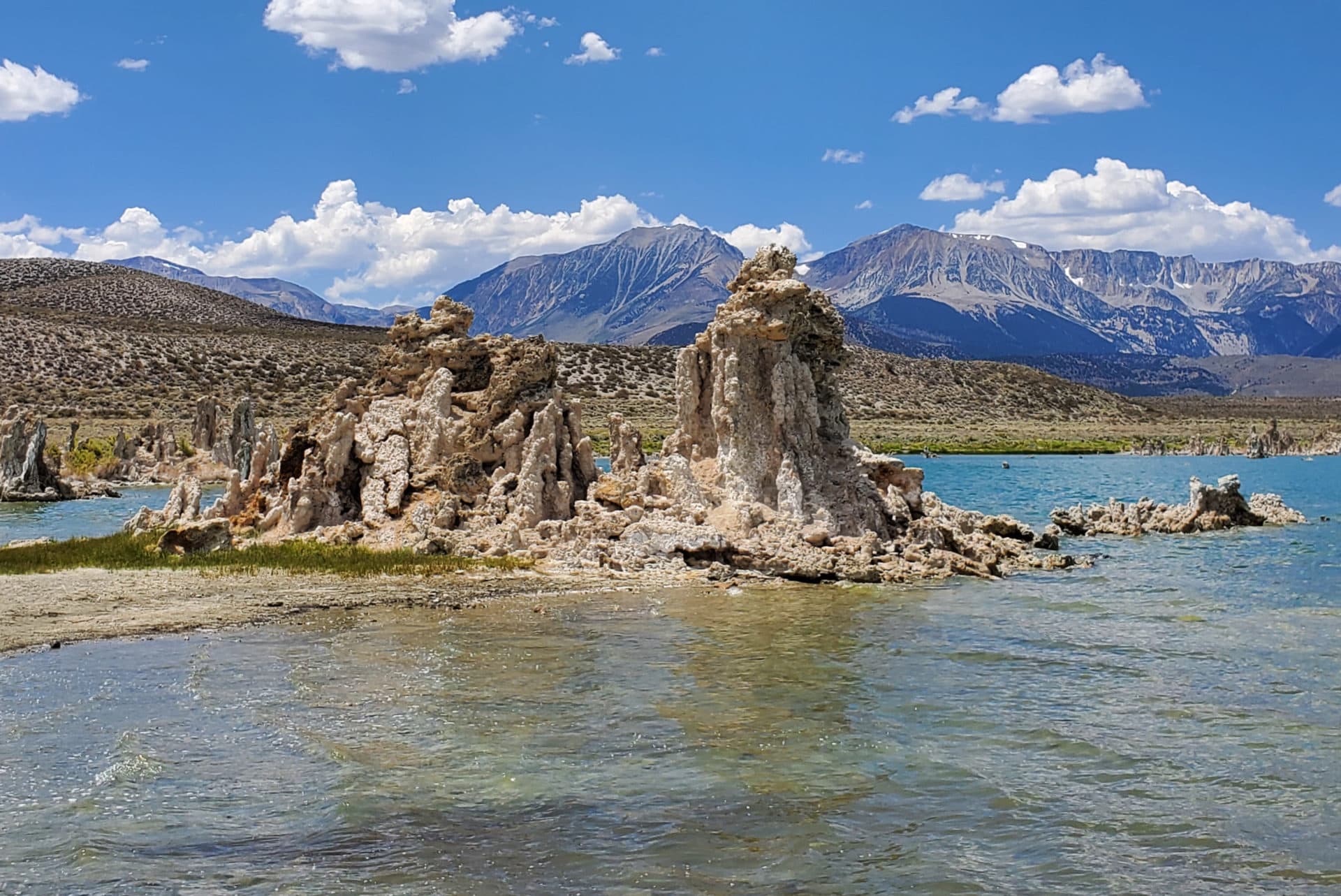 Tufas perched at the water's edge, while the Eastern Sierra Nevadas look on