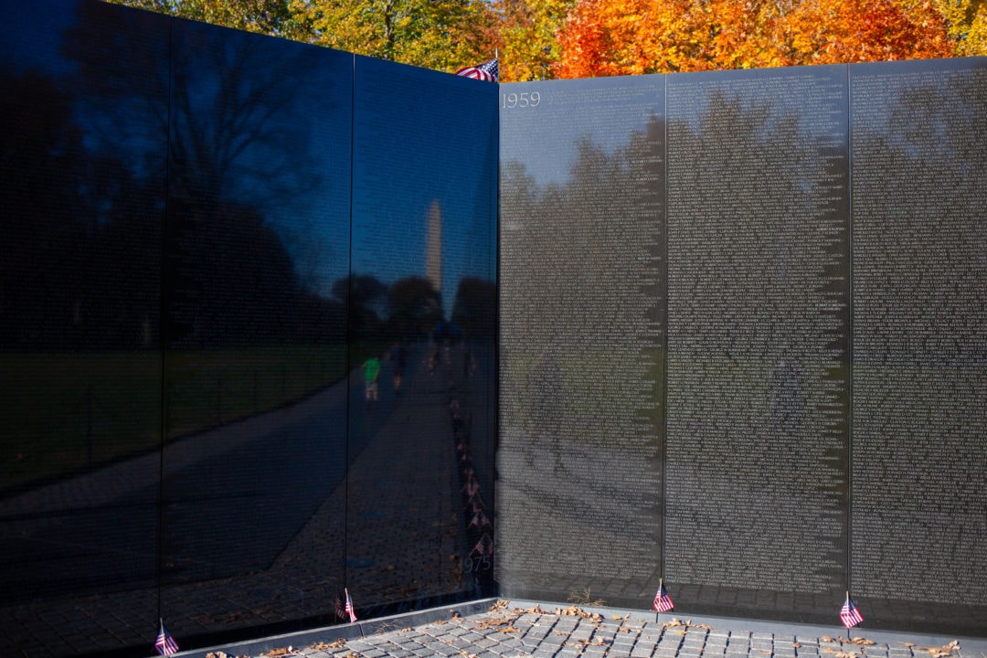 The names on the Vietnam Veterans Memorial wall are listed chronologically, beginning in 1959—and ending in 1975—at the center and highest point of the wall so the first and last deaths meet in the middle.