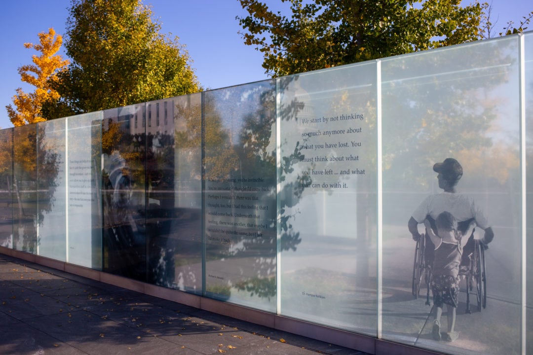 One of the 48 glass panels etched with photographs and quotes at the American Veterans Disabled for Life Memorial.