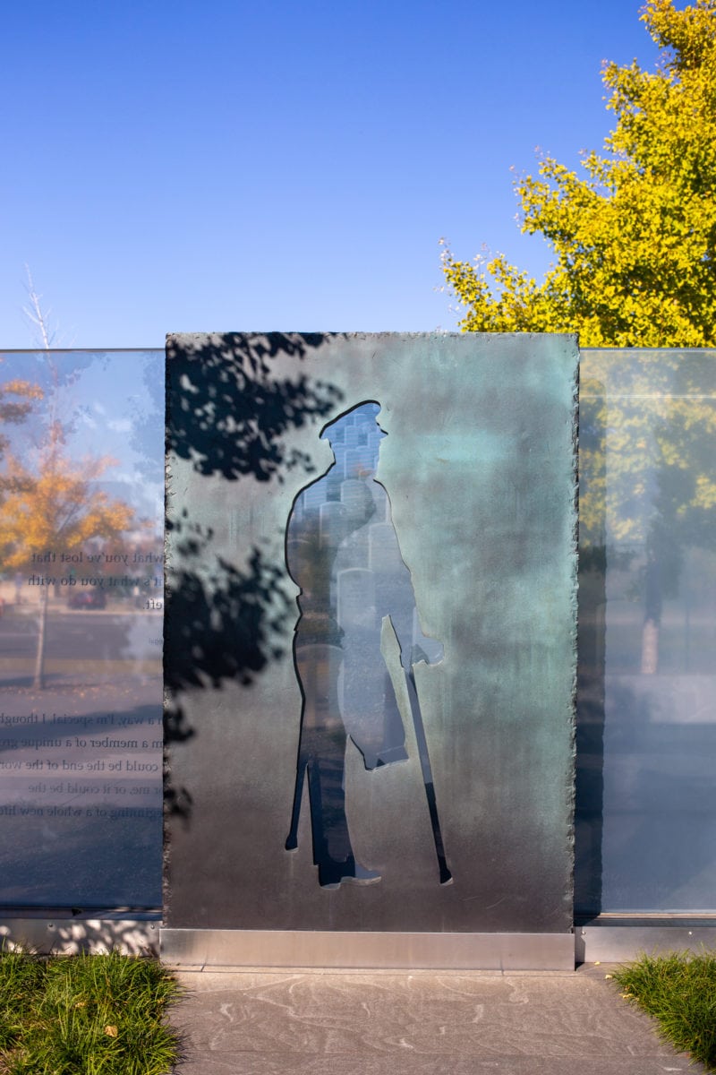 Four bronze sculptures by Larry Kirkland at the American Veterans Disabled for Life Memorial use negative space and silhouettes to highlight some of the challenges faced by disabled veterans.