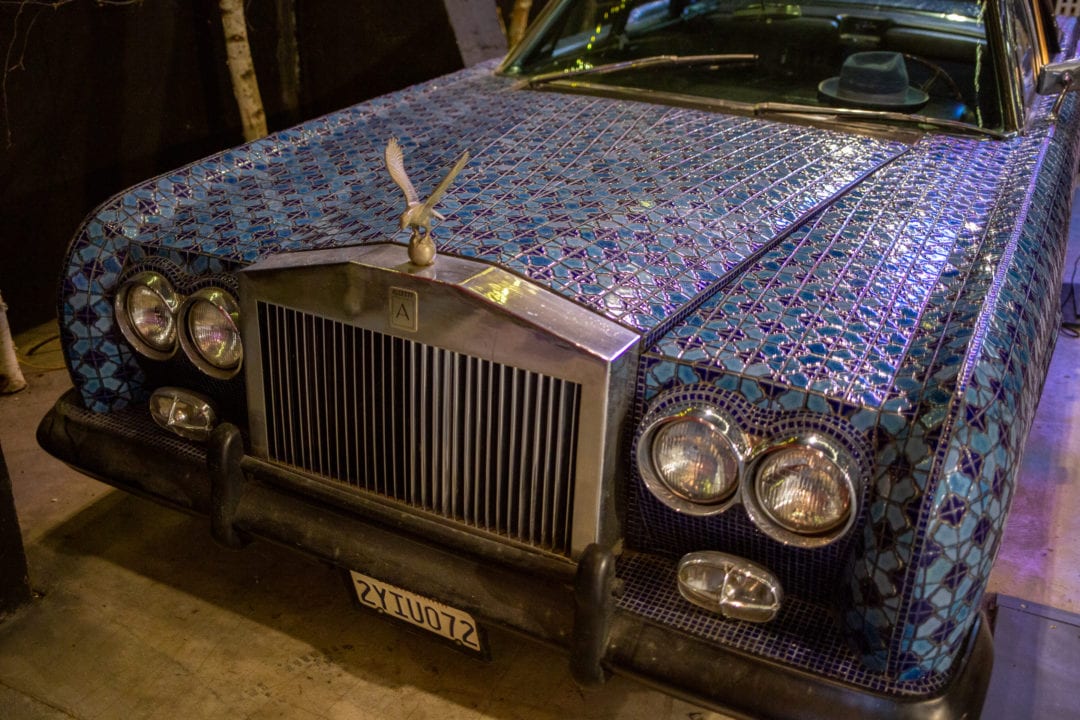 A car covered in decorative tiles.