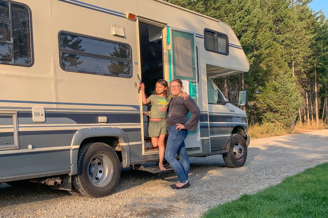 Sara Olsher and her daughter next to their RV in Idaho