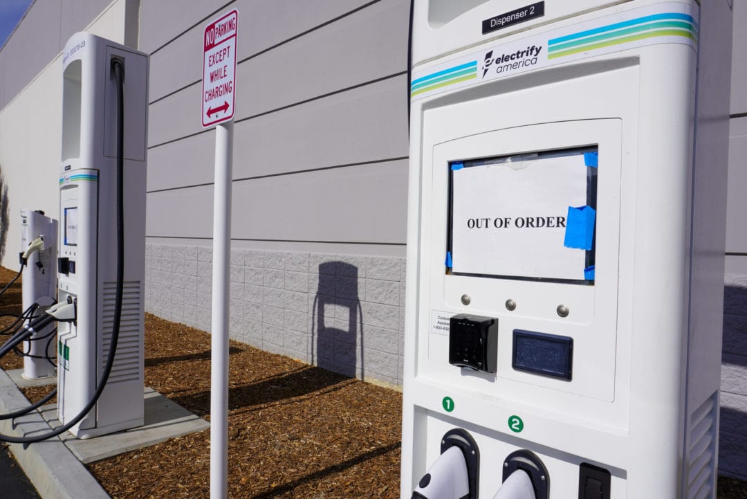 "Out of order" sign on an EV charging station