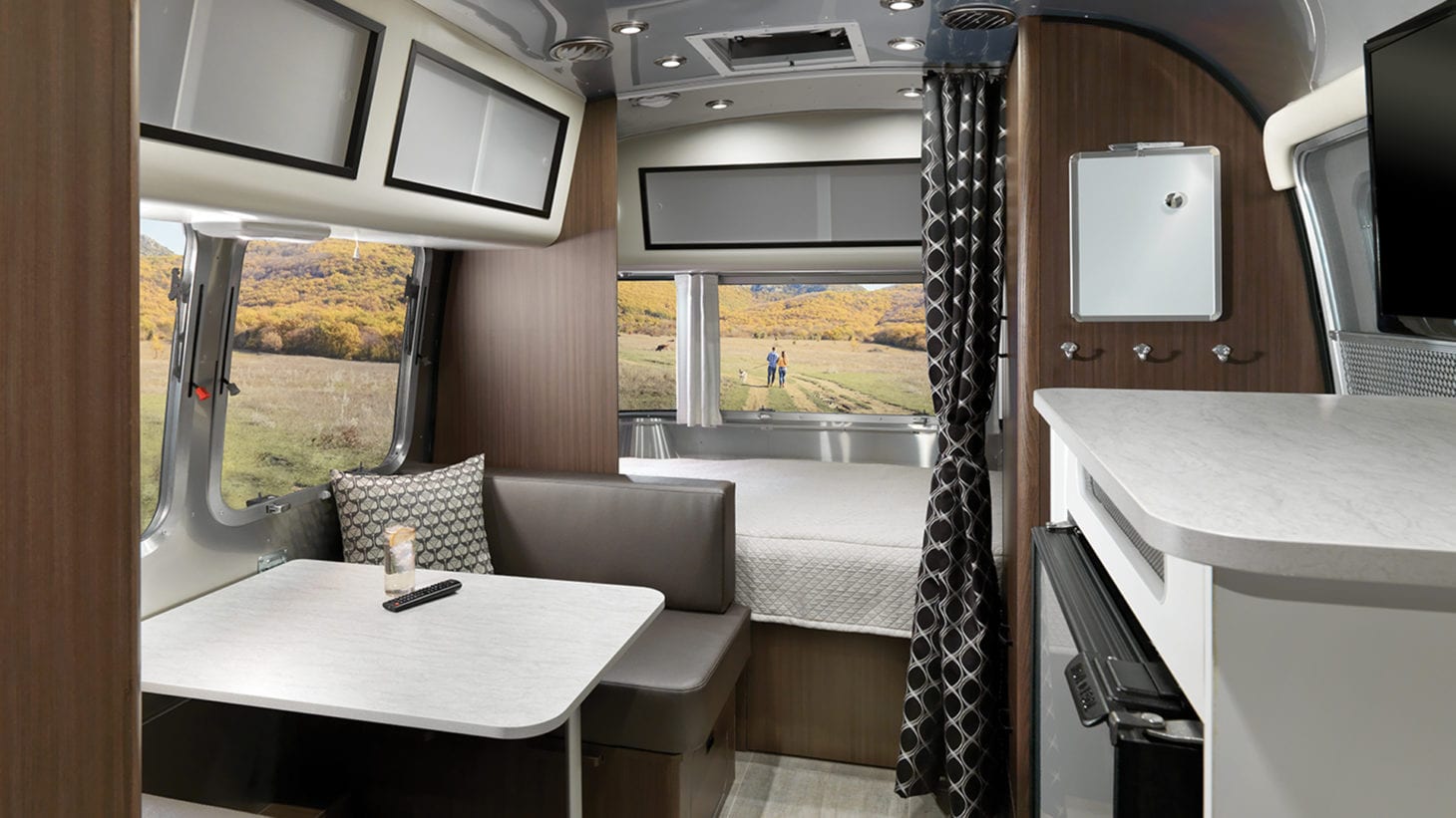 Interior view of Airstream trailer living and bed area