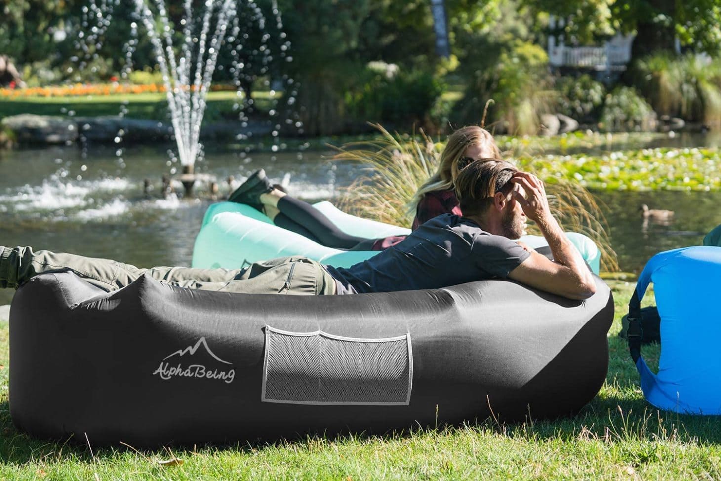 Friends lounging on inflatable lounger outside