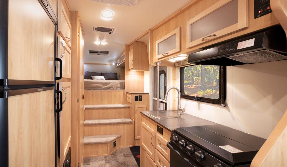 Interior view of fifth wheel trailer kitchen and bedroom area
