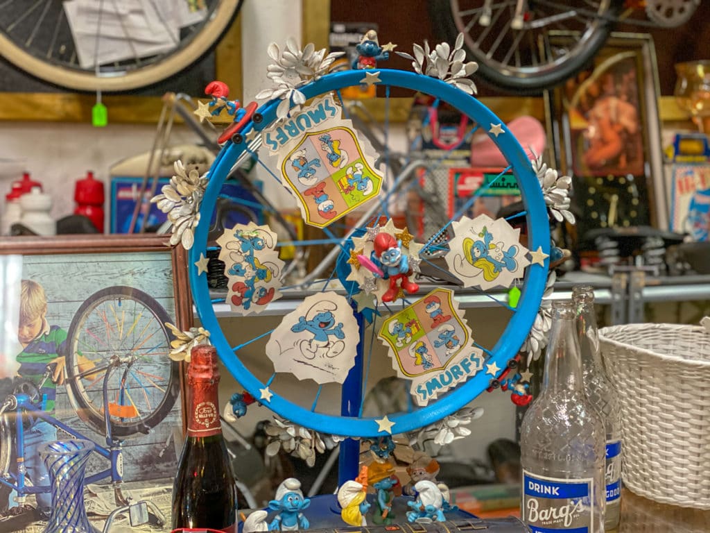 A wheel decorated with Smurf figurines.