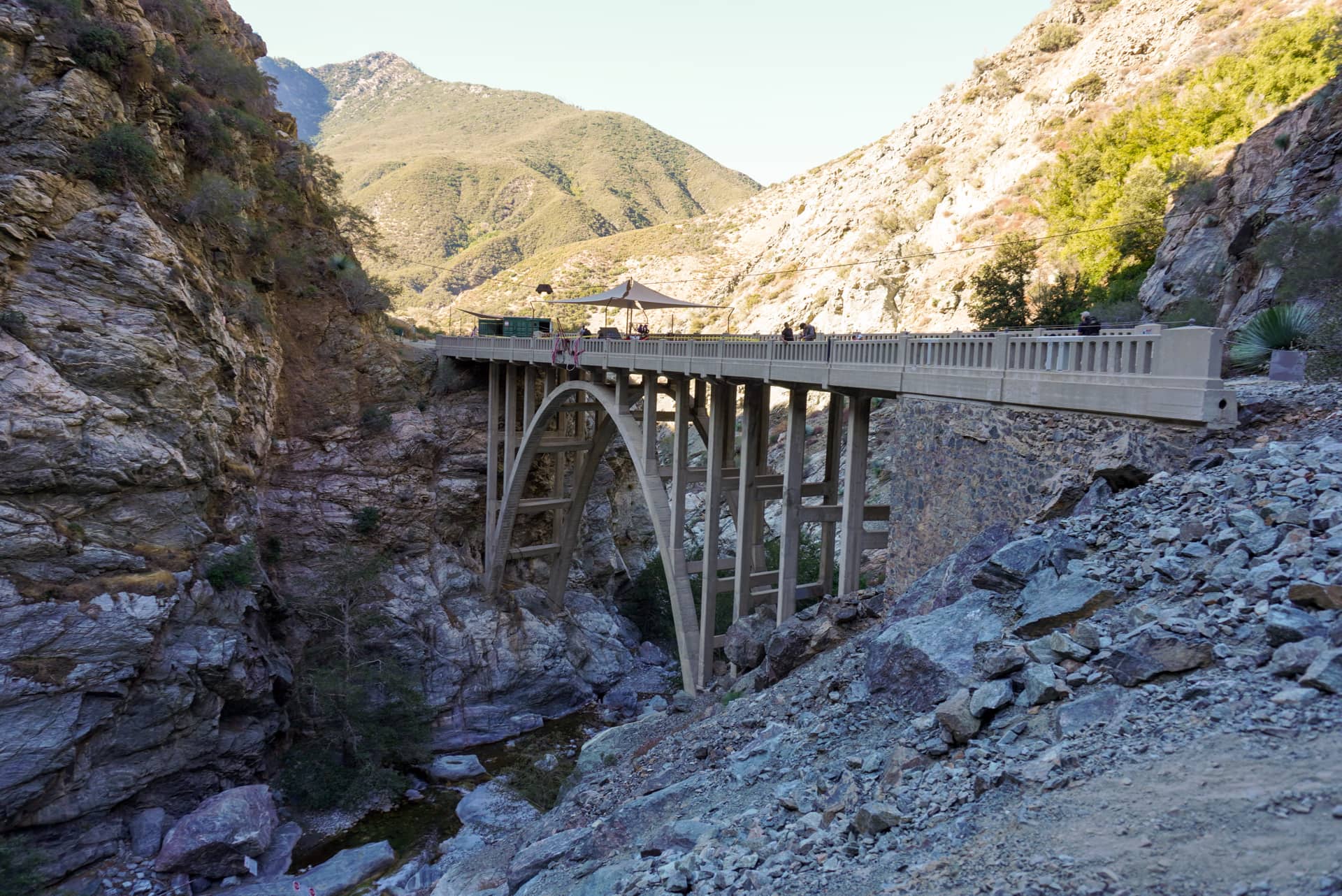The Bridge to Nowhere, an arch bridge surrounded by mountains, perched above a river gorge