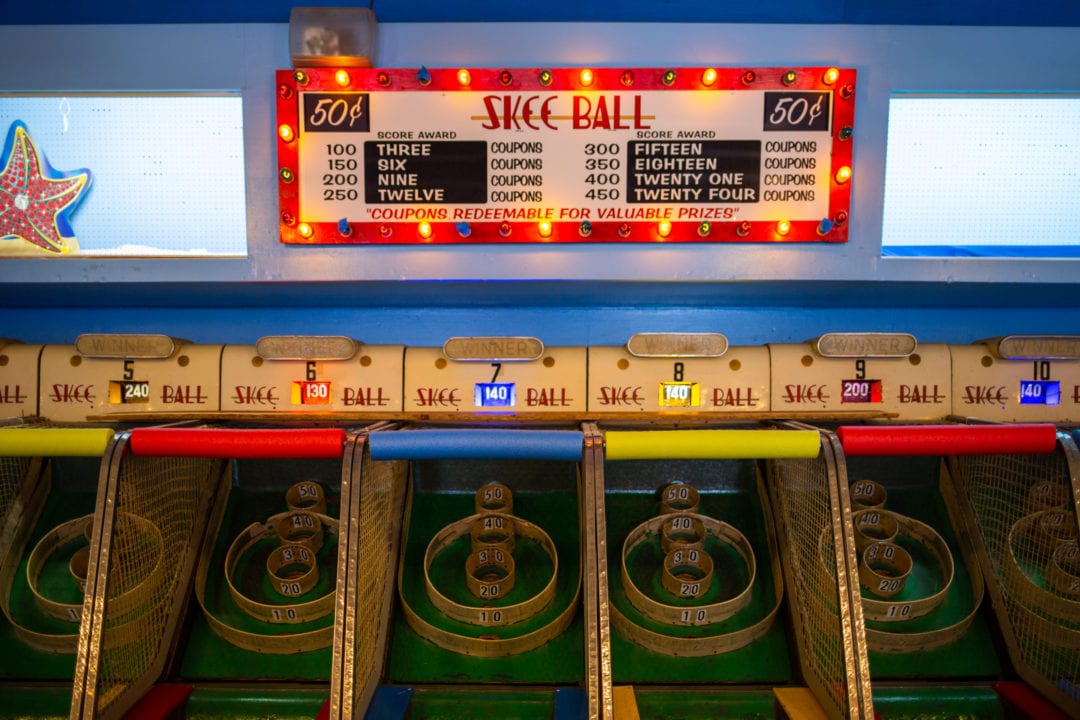 skee ball machines at an arcade