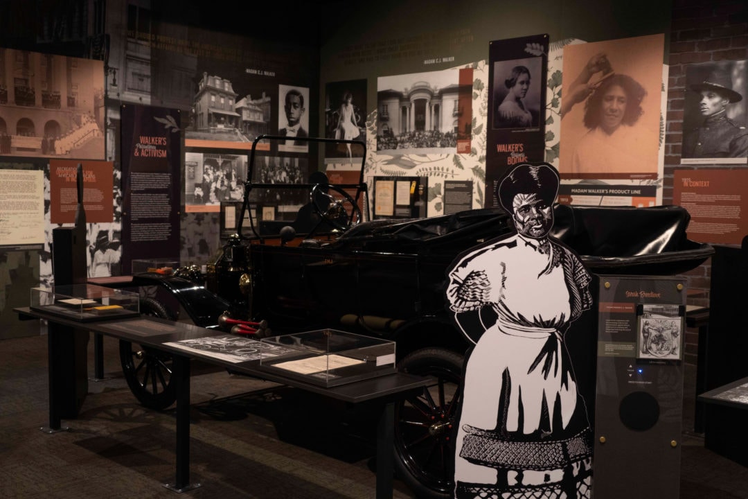a museum exhibit dedicated to madam c j walker containing photographs and artifacts