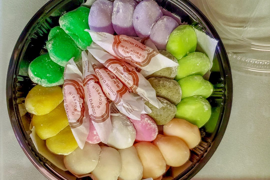 a plate with colorful mochi arranged in a circular pattern