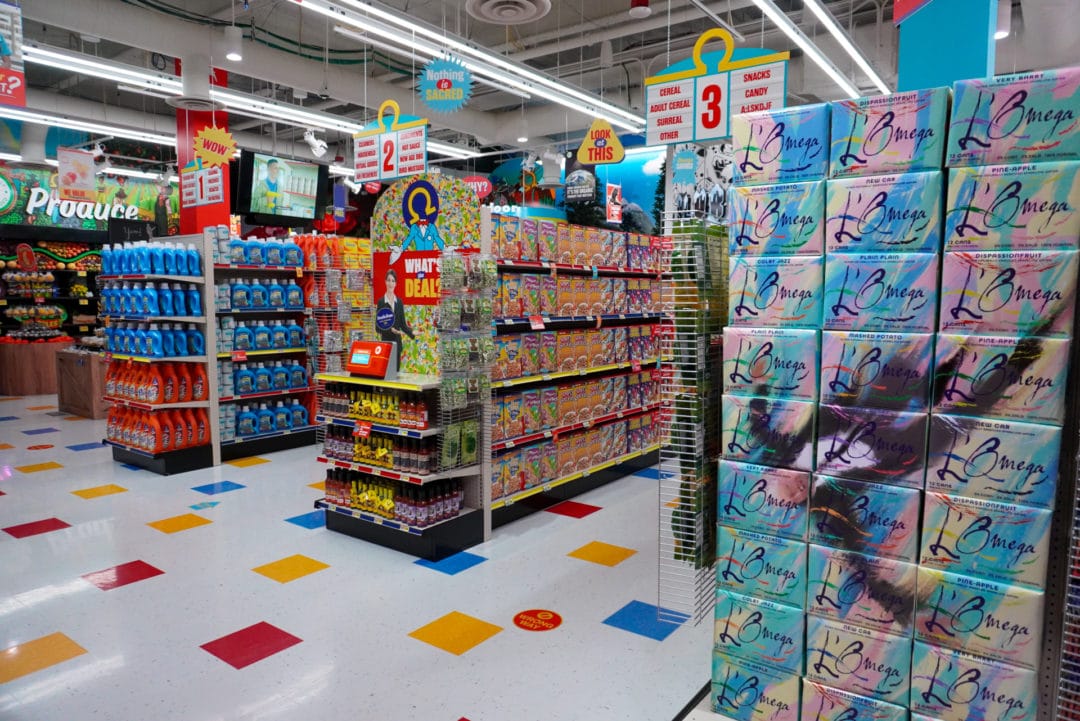 Aisles of groceries inside Omega Mart
