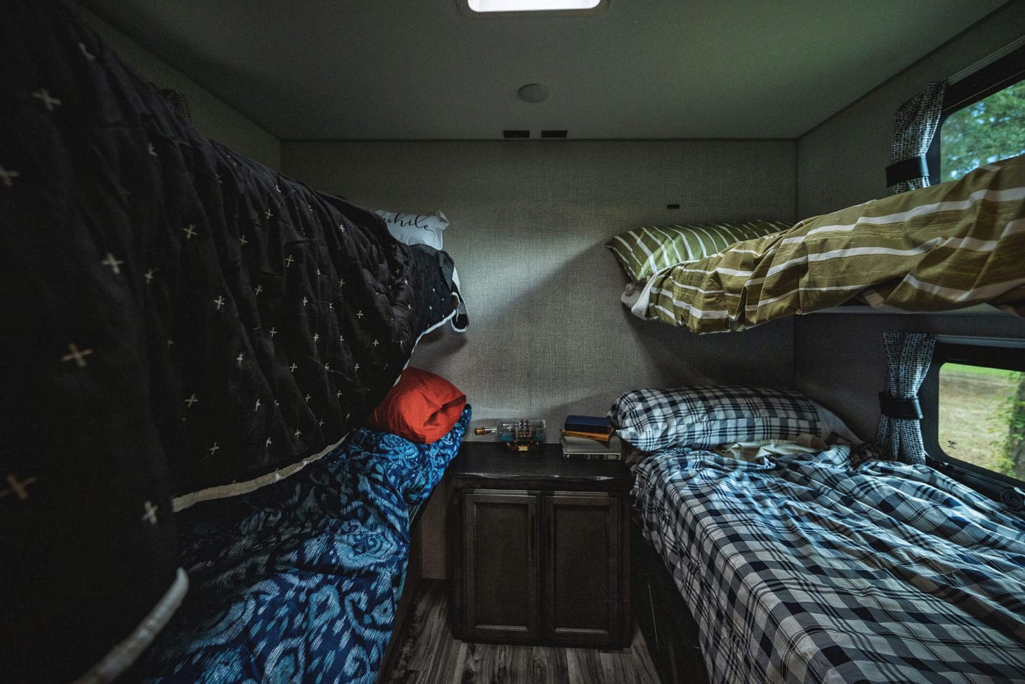 Back bunk room in an RV that converts to a desk area