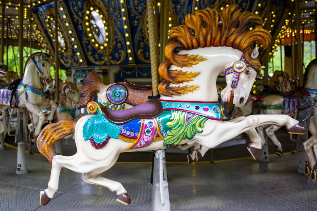 a colorful carved carousel horse
