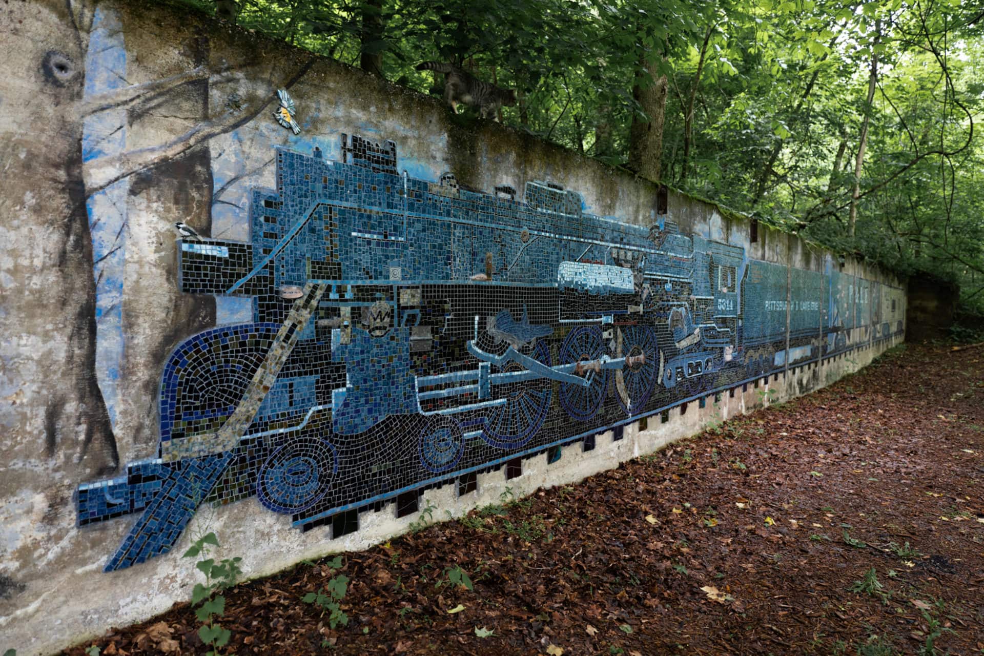 a large mosaic of a train in blue