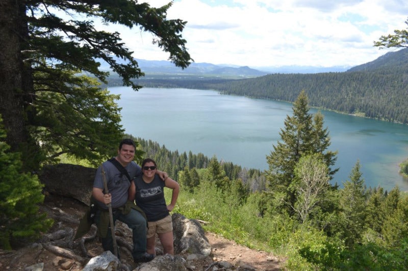 Two siblings on a hike with Jenny Lake in the background