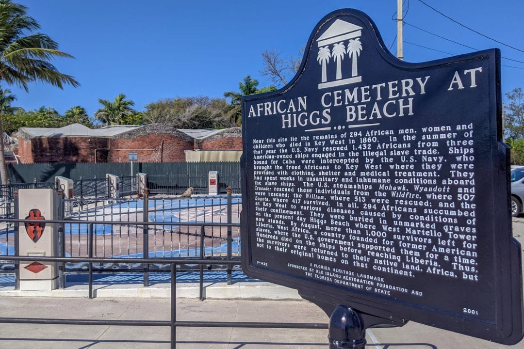 Informational sign marking the African cemetery at Higgs Beach