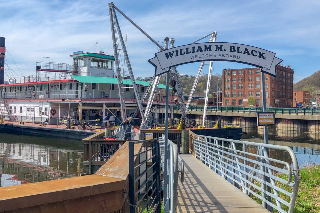 a ramp to a boat with a sign that says "william m. black welcome aboard"
