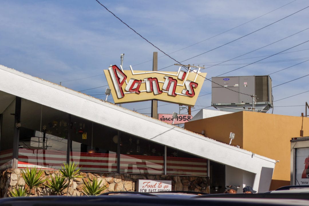 the exterior and sign for pann's restaurant in los angeles