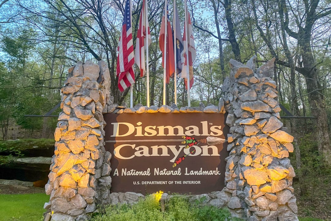 an entrance sign for dismals canyon