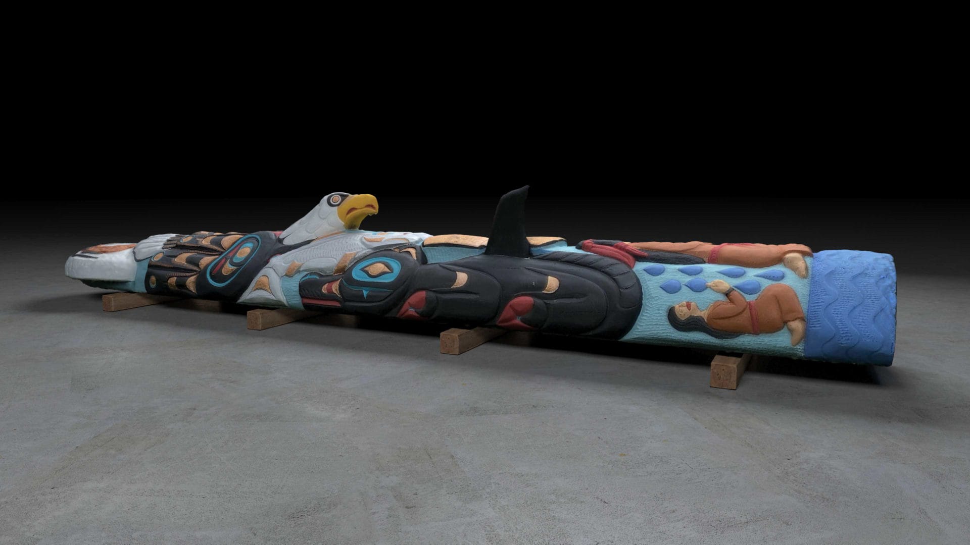 A 25-foot-tall, 5,000-lb painted and carved totem pole