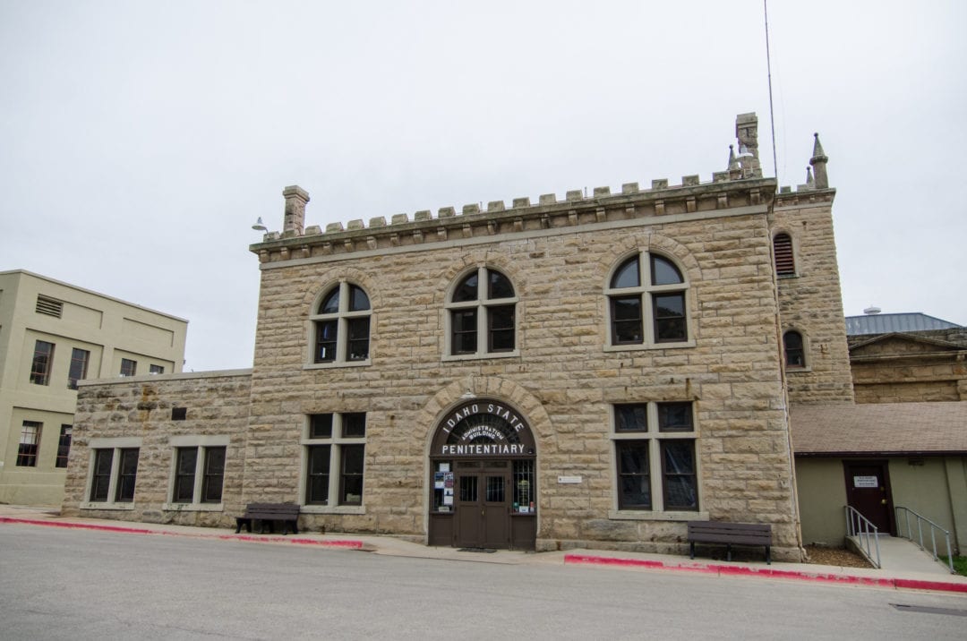 a beige stone building formerly the old idaho state penitentiary