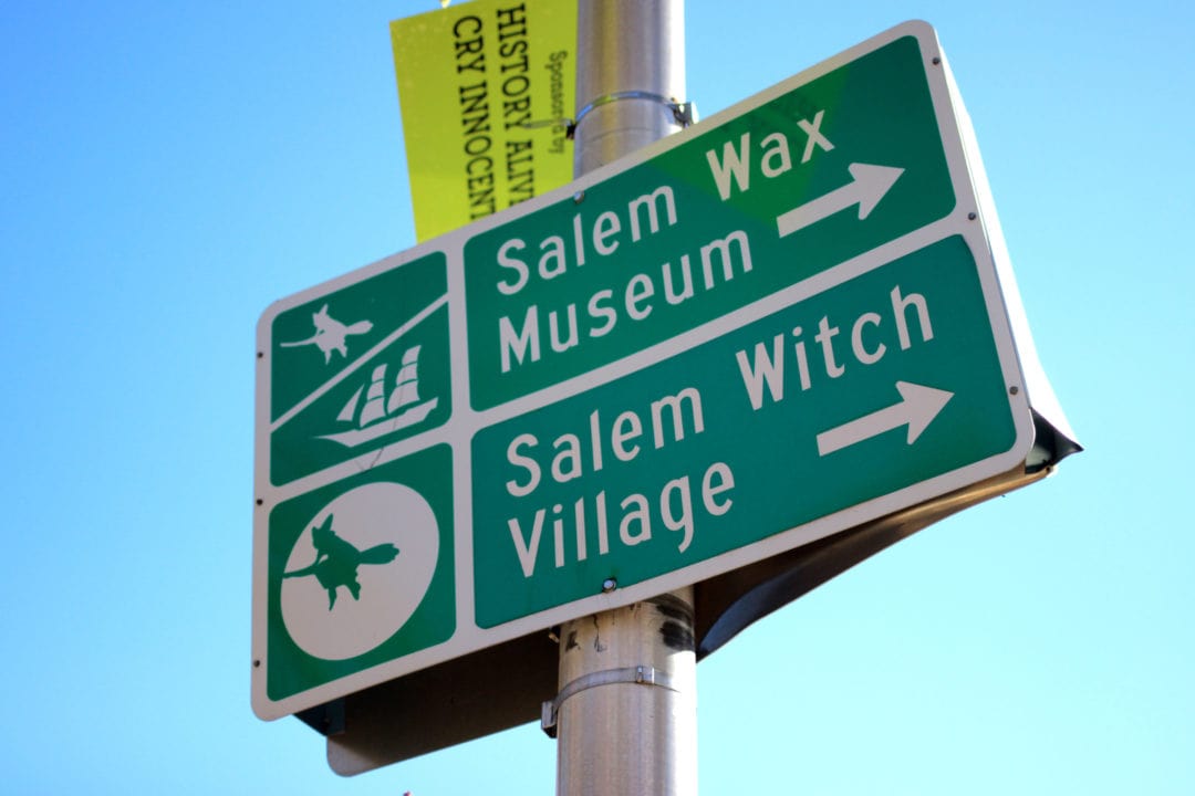 directional signage to the salem wax museum and salem witch village