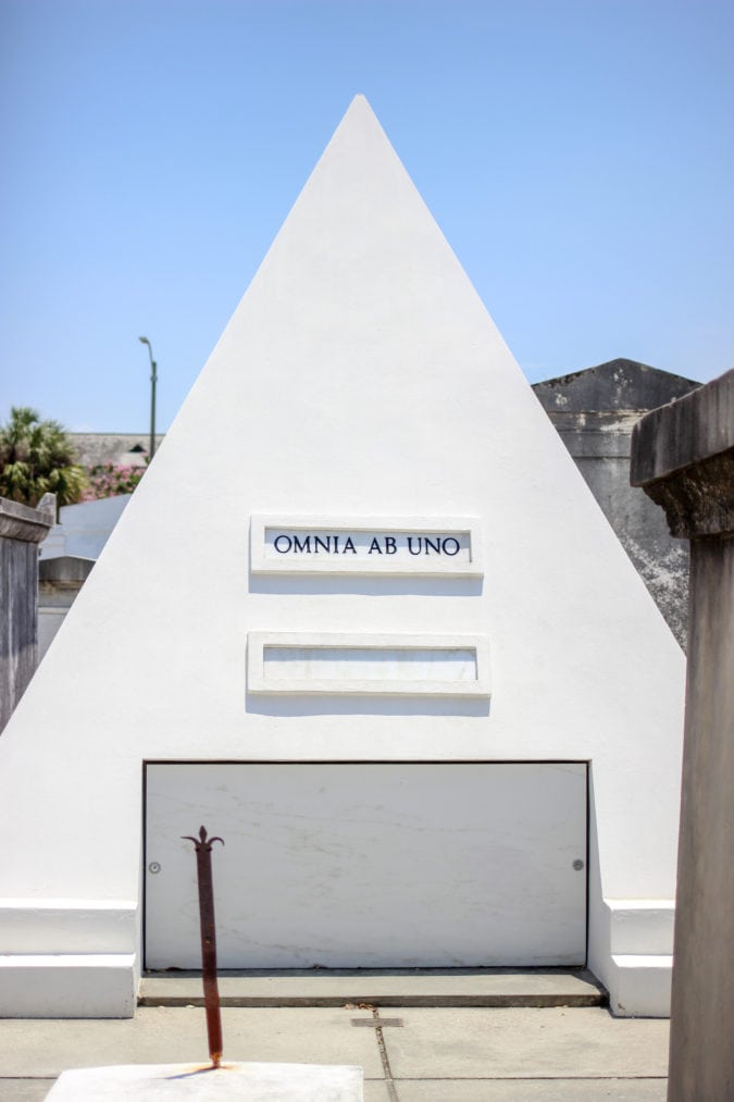 a white pyramid that says "omnia ab uno"