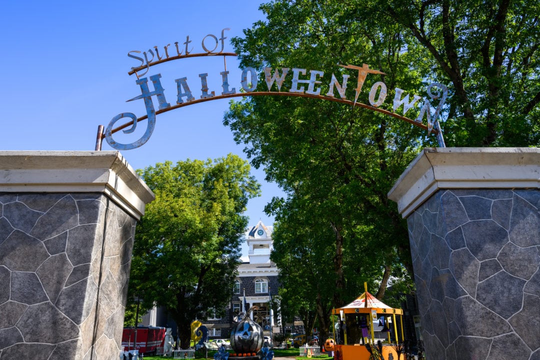 An arched metal sign says spirit of halloweentown
