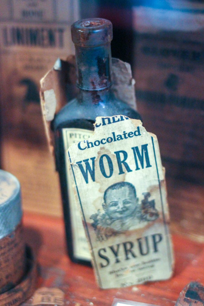 a bottle of chocolated worm syrup
