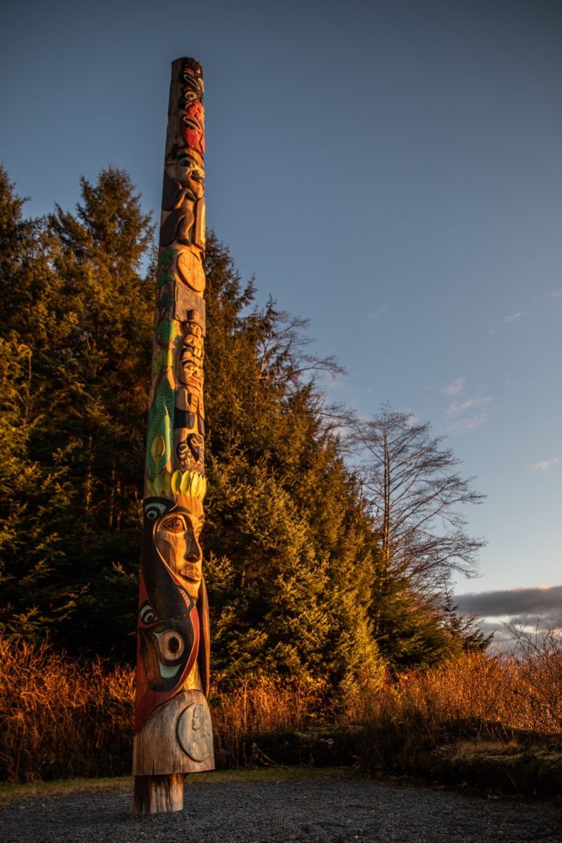 a carved and painted totem pole